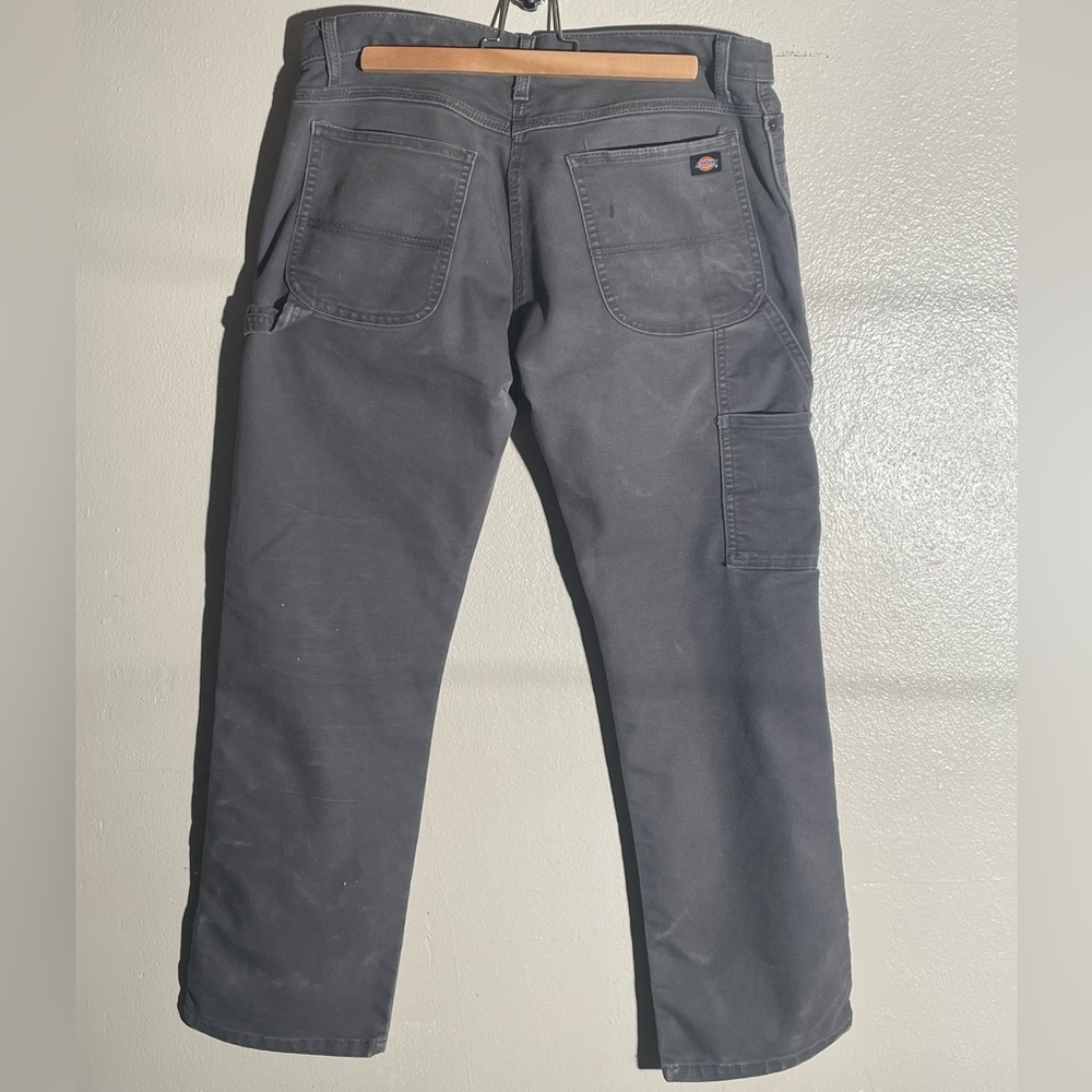 worn grey dickies workman’s pants